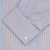 View 2 of product The Turnbull & Asser Red and Navy Supraluxe Stripe Shirt features a T&A collar, double cuffs, and thin vertical blue and red stripes on white premium cotton. Displayed folded against a plain white background.