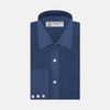View 1 of product The Turnbull & Asser Navy Linen Shirt features a T&A collar, long sleeves, and 3-button cuffs, making it a stylish summer essential. Displayed neatly folded against a plain white background.