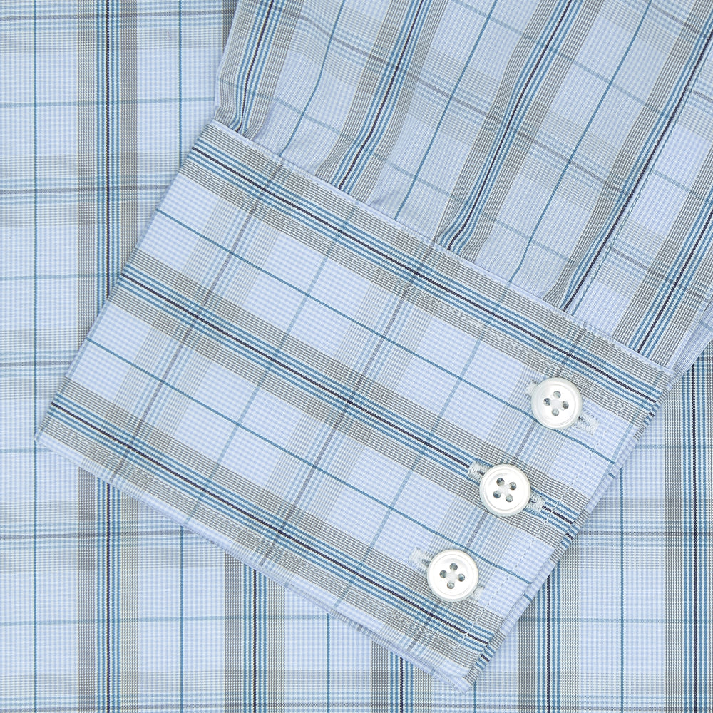 A neatly folded Turnbull & Asser Grey, Turquoise and Sky Blue Mixed Check Shirt with T&A collar and 3-button cuffs is displayed on a plain white background.