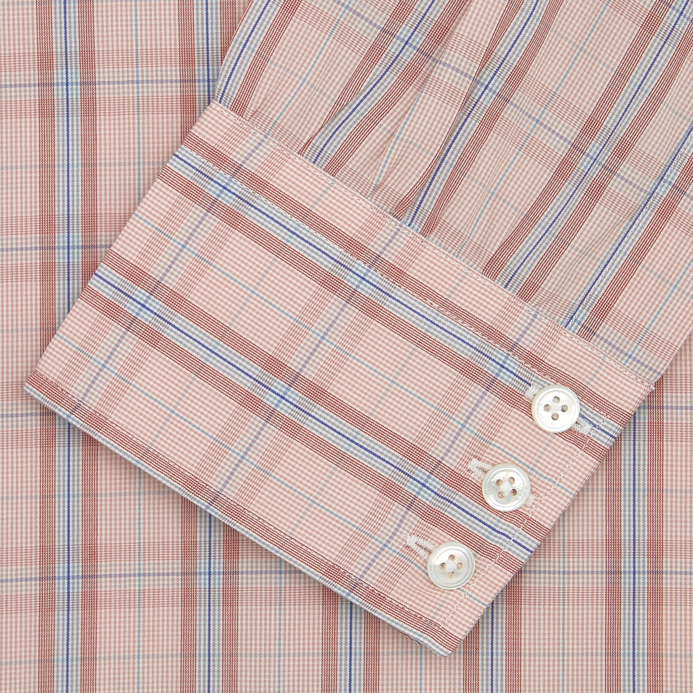 A neatly folded Turnbull & Asser Red, Grey and Navy Mixed Check Shirt features a T&A collar, white buttons, and 3-button cuffs. The label inside the collar is visible—a standout for any seasonal look.