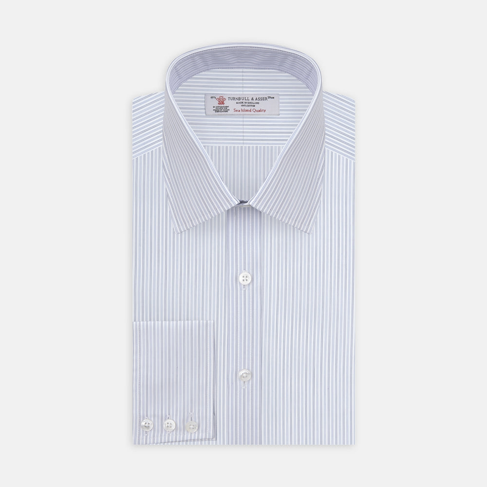 The Turnbull & Asser Light Blue Double Stripe Sea Island Quality Cotton Shirt features a T&A collar, 3-button cuffs, and white buttons, neatly folded and displayed against a plain light background.