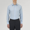 View 2 of product The Turnbull & Asser Blue Cashmere Blend Shirt features a T&A collar and 3-button cuffs, elegantly folded and showcased against a plain white background.