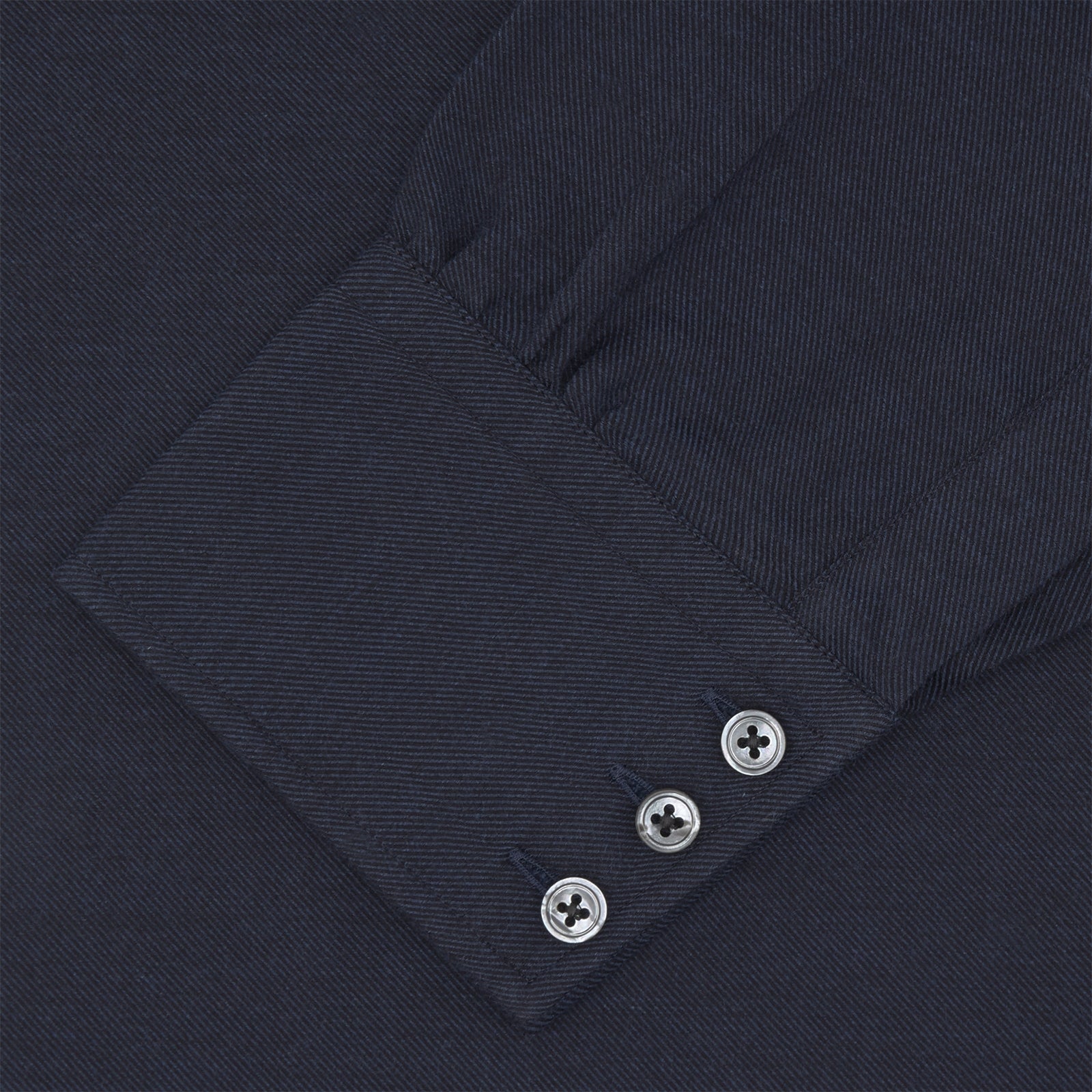 View 4 of product A navy cashmere blend Turnbull & Asser shirt with a T&A collar and 3-button cuffs, neatly folded and displayed against a plain white background.
