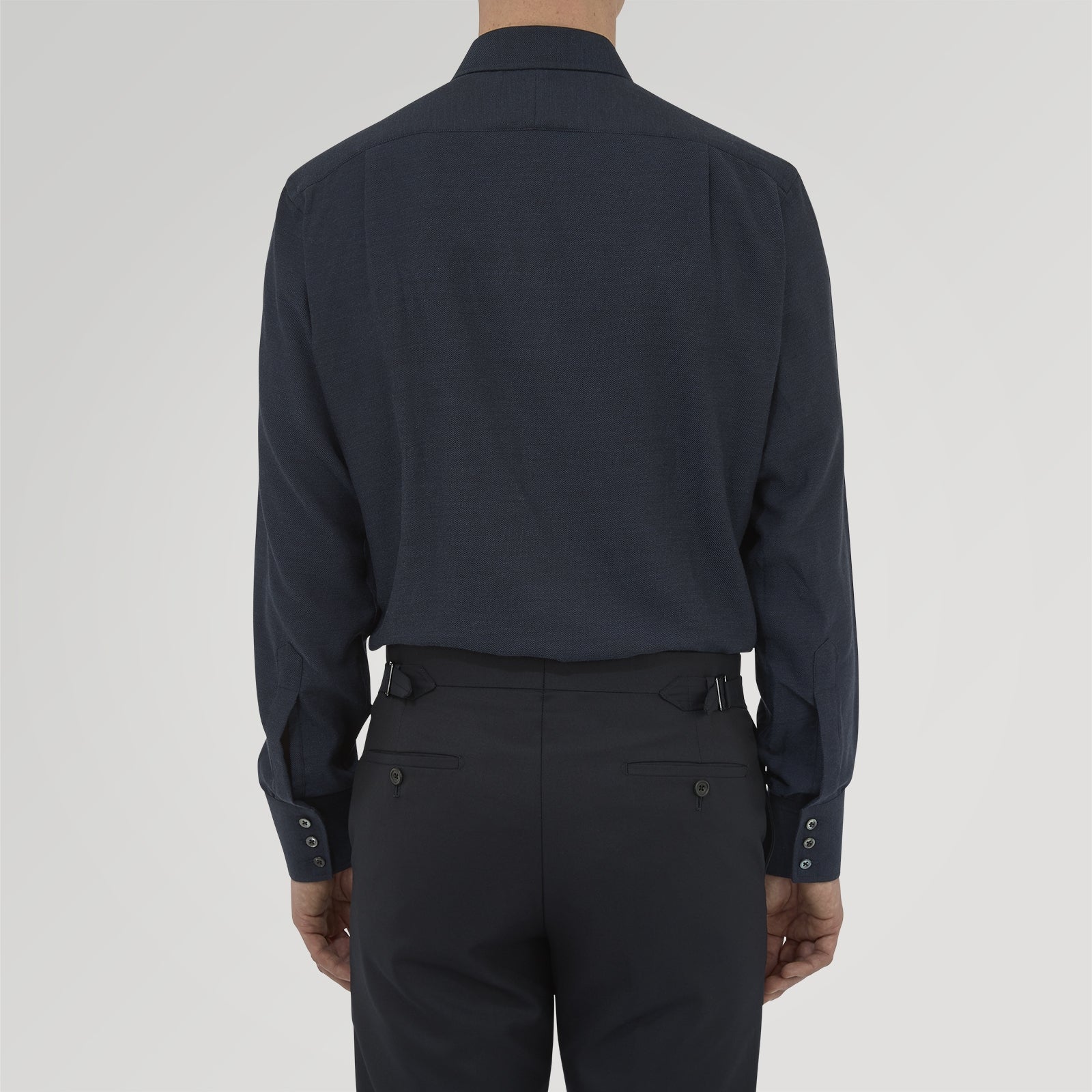 View 3 of product A navy cashmere blend Turnbull & Asser shirt with a T&A collar and 3-button cuffs, neatly folded and displayed against a plain white background.