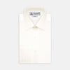 View 1 of product The Cream Silk Shirt by Turnbull & Asser features a T&A collar and 3-button cuffs, displayed folded on a light background—perfect for sophisticated evening wear.