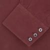 View 6 of product The Turnbull & Asser Burgundy Silk Shirt features a T&A collar and 3-button cuffs, offering a refined alternative to a black tie for modern style. Displayed folded on a white background.