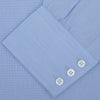 View 4 of product The Turnbull & Asser Light Blue End On End Shirt with Regent Collar and 3 Button Cuffs is shown neatly folded on a white background, featuring a visible chest pocket and brand label inside the collar.