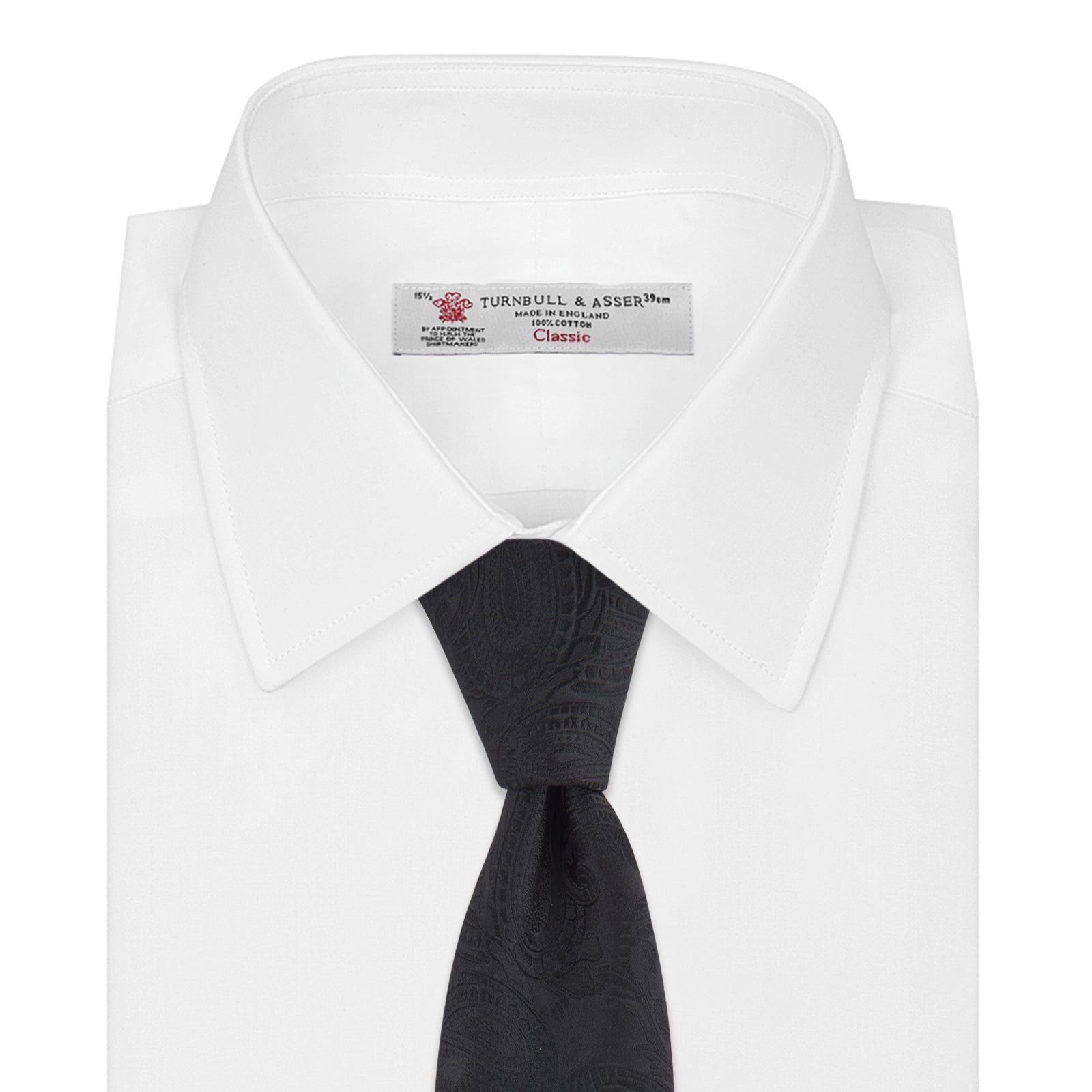 View 2 of product The Black Paisley Silk Tie by Turnbull & Asser features an elegant swirling paisley design with a subtle sheen—an all-black statement accessory photographed rolled up on a white background.