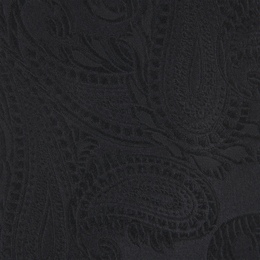 The Black Paisley Silk Tie by Turnbull & Asser features an elegant swirling paisley design with a subtle sheen—an all-black statement accessory photographed rolled up on a white background.