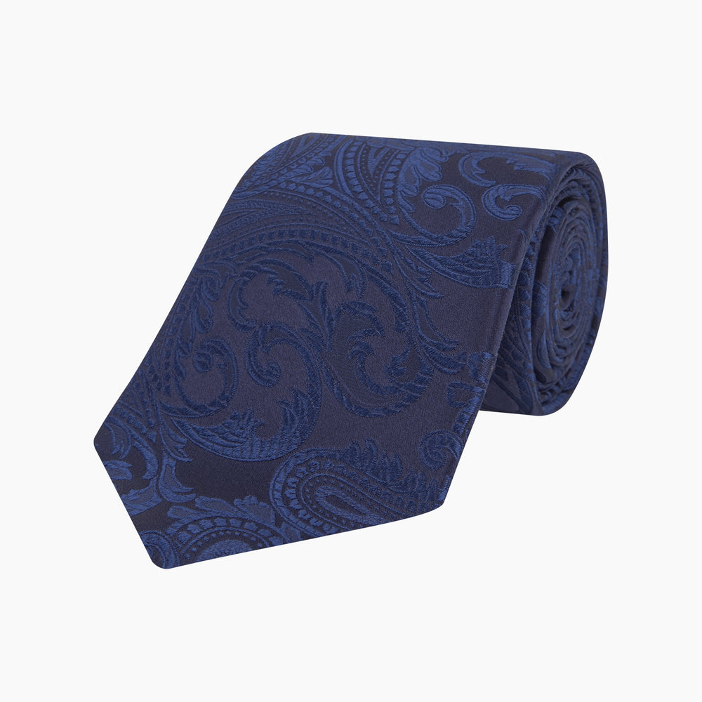 The Navy Paisley Silk Tie by Turnbull & Asser is a classic men's accessory in blue and black, adding sophistication to any look.