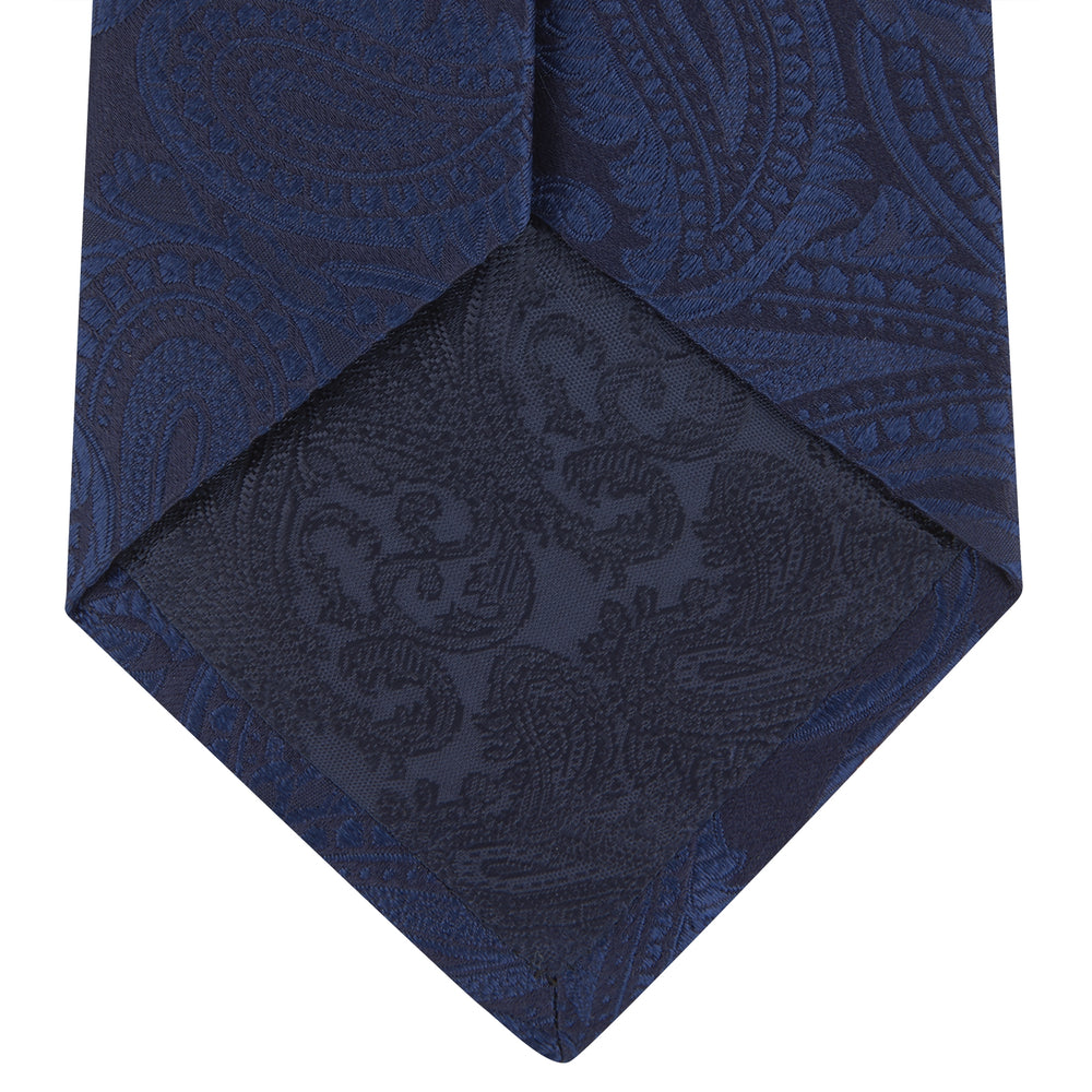 The Navy Paisley Silk Tie by Turnbull & Asser is a classic men's accessory in blue and black, adding sophistication to any look.