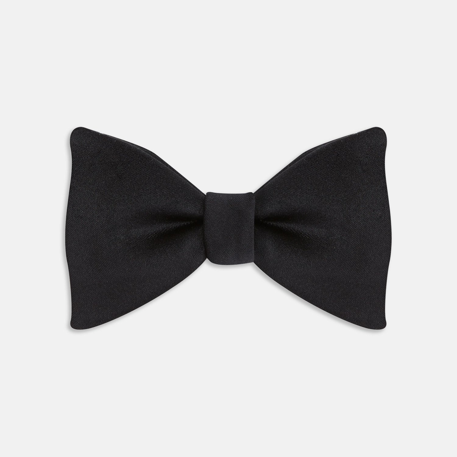 View 1 of product The Turnbull & Asser Black Satin Bow Tie features a classic, neatly tied shape, displayed on a white background—a sophisticated accessory for formal attire.