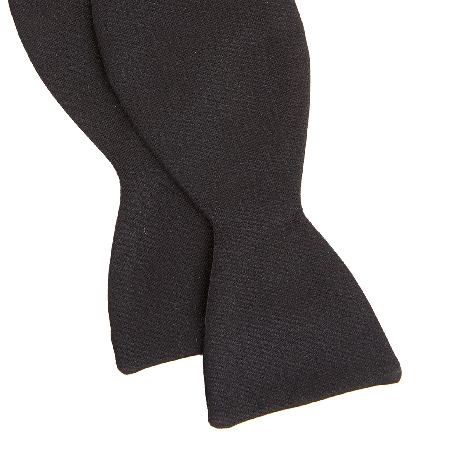 View 3 of product The Turnbull & Asser Black Silk Bow Tie features a matte finish and classic design, ideal for formal occasions. Shown pre-tied against a plain white background.