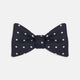 The Winston Navy and White Spot Silk Bow Tie by Turnbull & Asser features classic white polka dots on navy silk, reminiscent of Winston Churchill's style, and is shown against a plain white background.