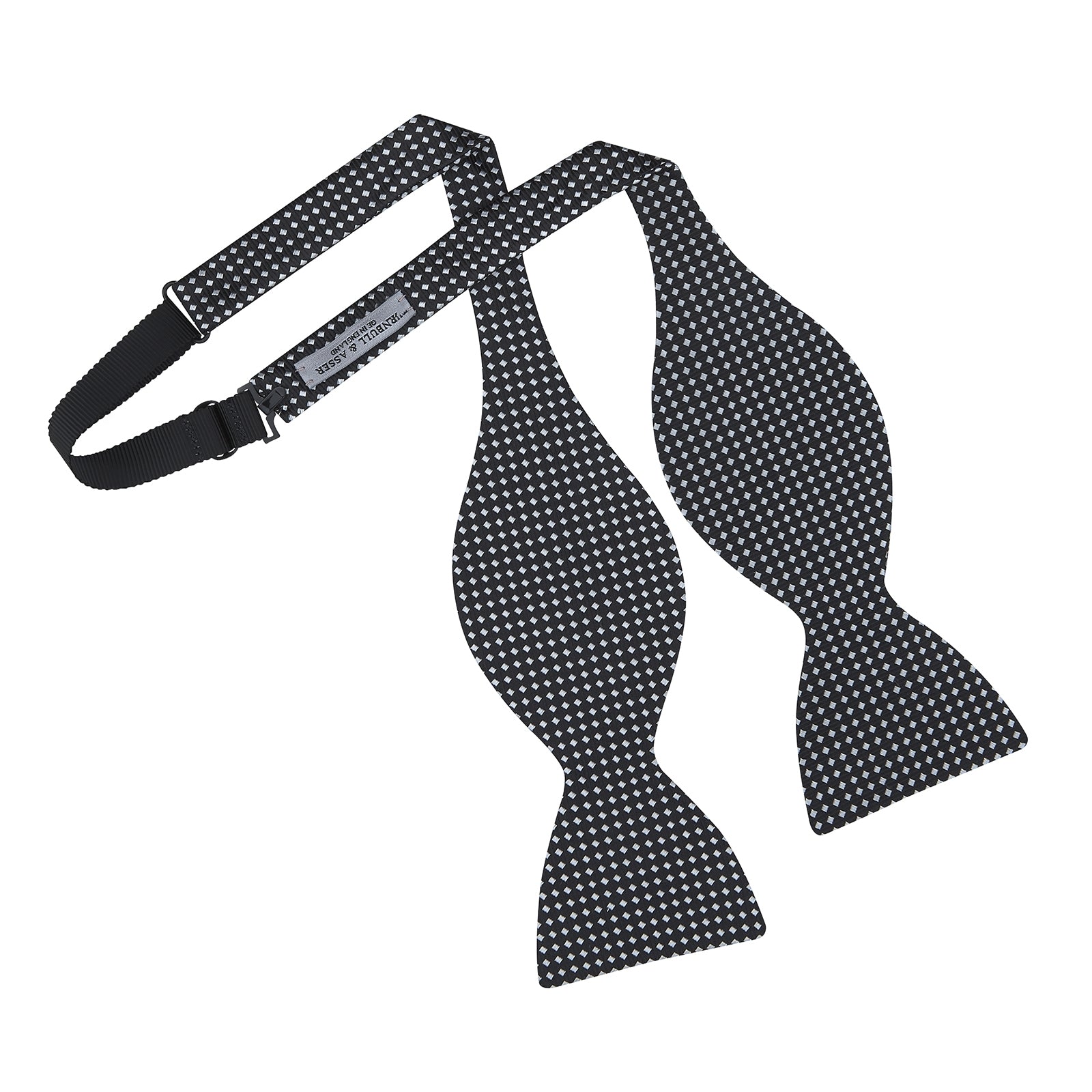 View 3 of product The Turnbull & Asser Diamond Black and White Silk Bow Tie features a black woven silk design with a tessellated diamond pattern of small white shapes, shown against a plain white background.