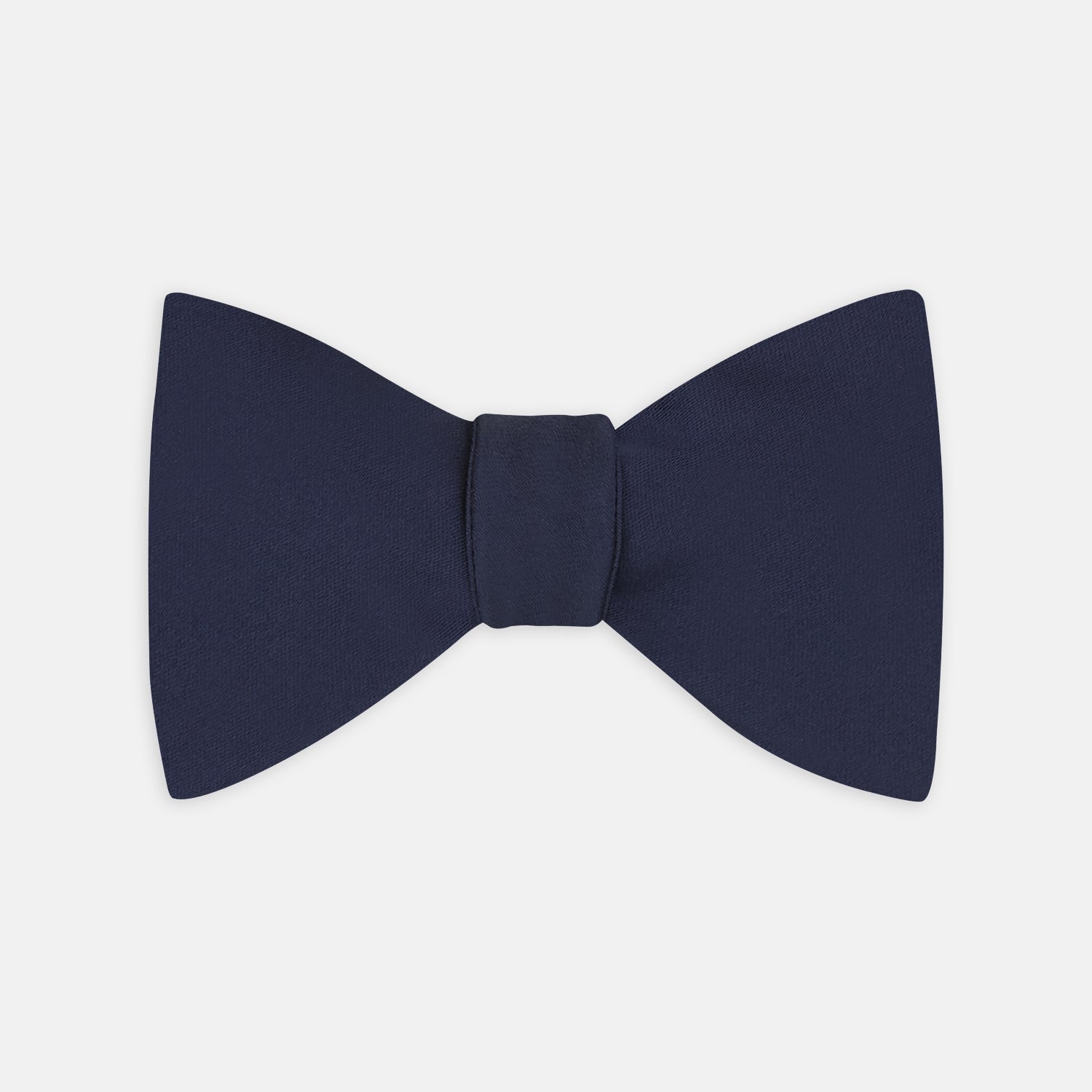 View 1 of product The Turnbull & Asser Navy Satin Silk Bow Tie is elegantly showcased against a plain white background.