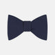 The Turnbull & Asser Navy Satin Silk Bow Tie is elegantly showcased against a plain white background.