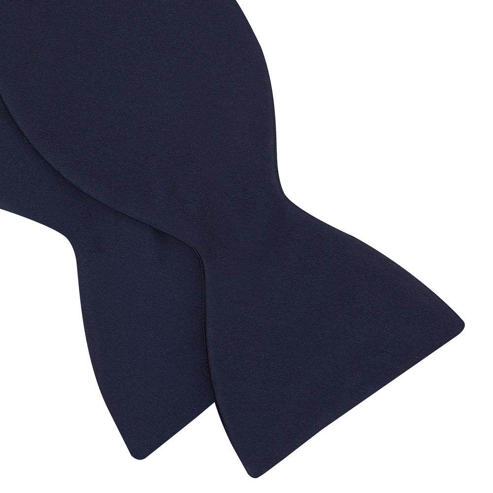 The Turnbull & Asser Navy Satin Silk Bow Tie is elegantly showcased against a plain white background.
