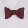 View 2 of product The Turnbull & Asser Burgundy Barathea Bow Tie, shown neatly tied with pointed ends on a white background, features smooth matte fabric for a refined formal look.