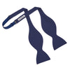 View 3 of product The Turnbull & Asser Navy Barathea Bow Tie features a classic butterfly shape in deep blue silk, ideal for formal occasions, shown against a white background.