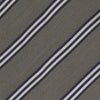 View 3 of product The Turnbull & Asser Grey Diagonal Stripe Cotton and Silk Tie features a navy, grey, and white striped pattern and is shown rolled up against a plain white background.