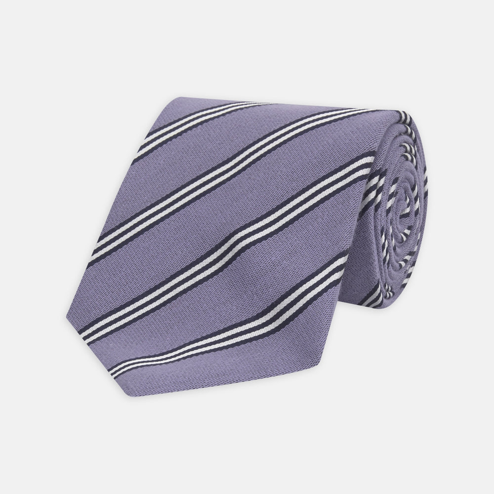 The Turnbull & Asser Lilac Diagonal Stripe Cotton and Silk Tie features classic black and white stripes, shown neatly rolled on a white background.