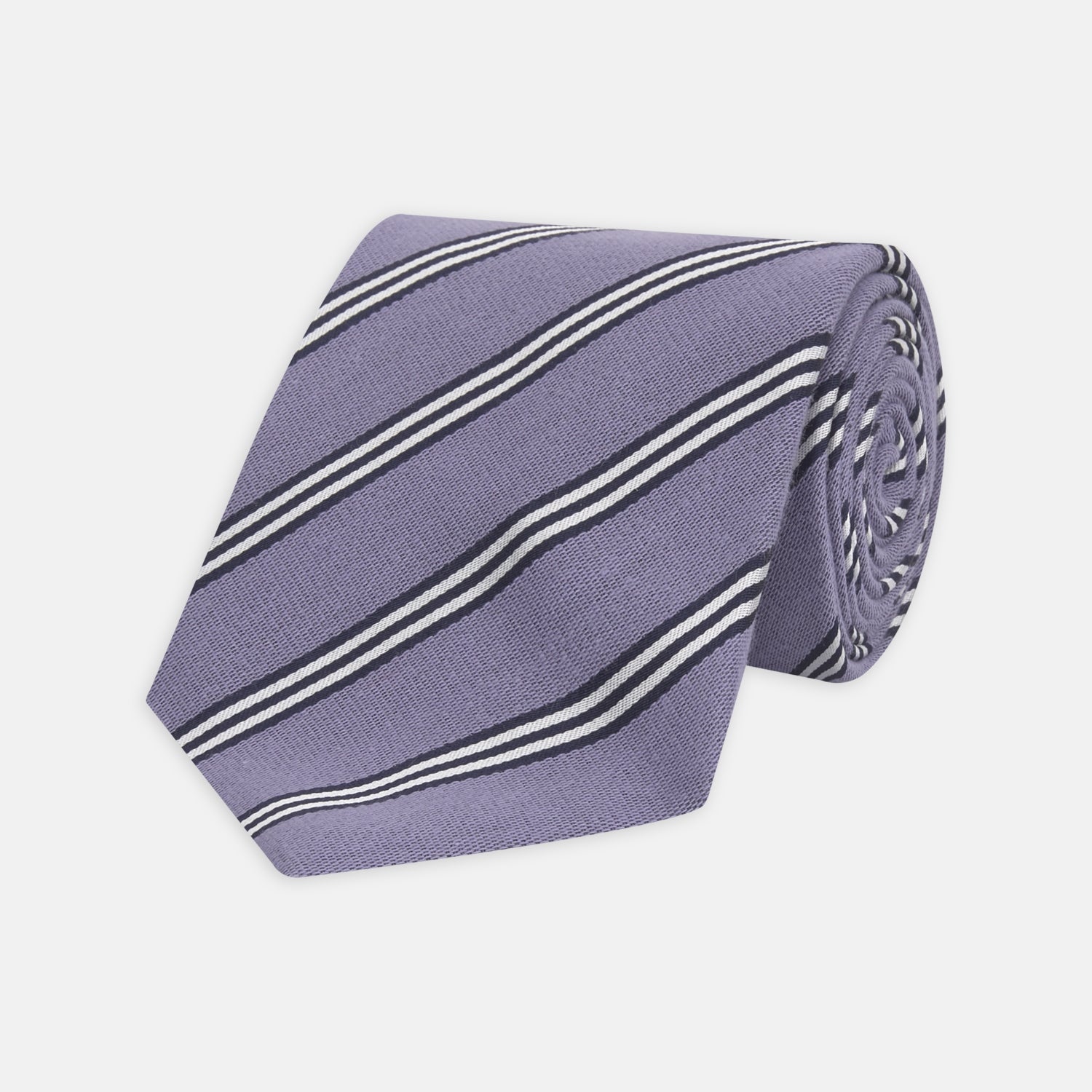View 1 of product The Turnbull & Asser Lilac Diagonal Stripe Cotton and Silk Tie features classic black and white stripes, shown neatly rolled on a white background.