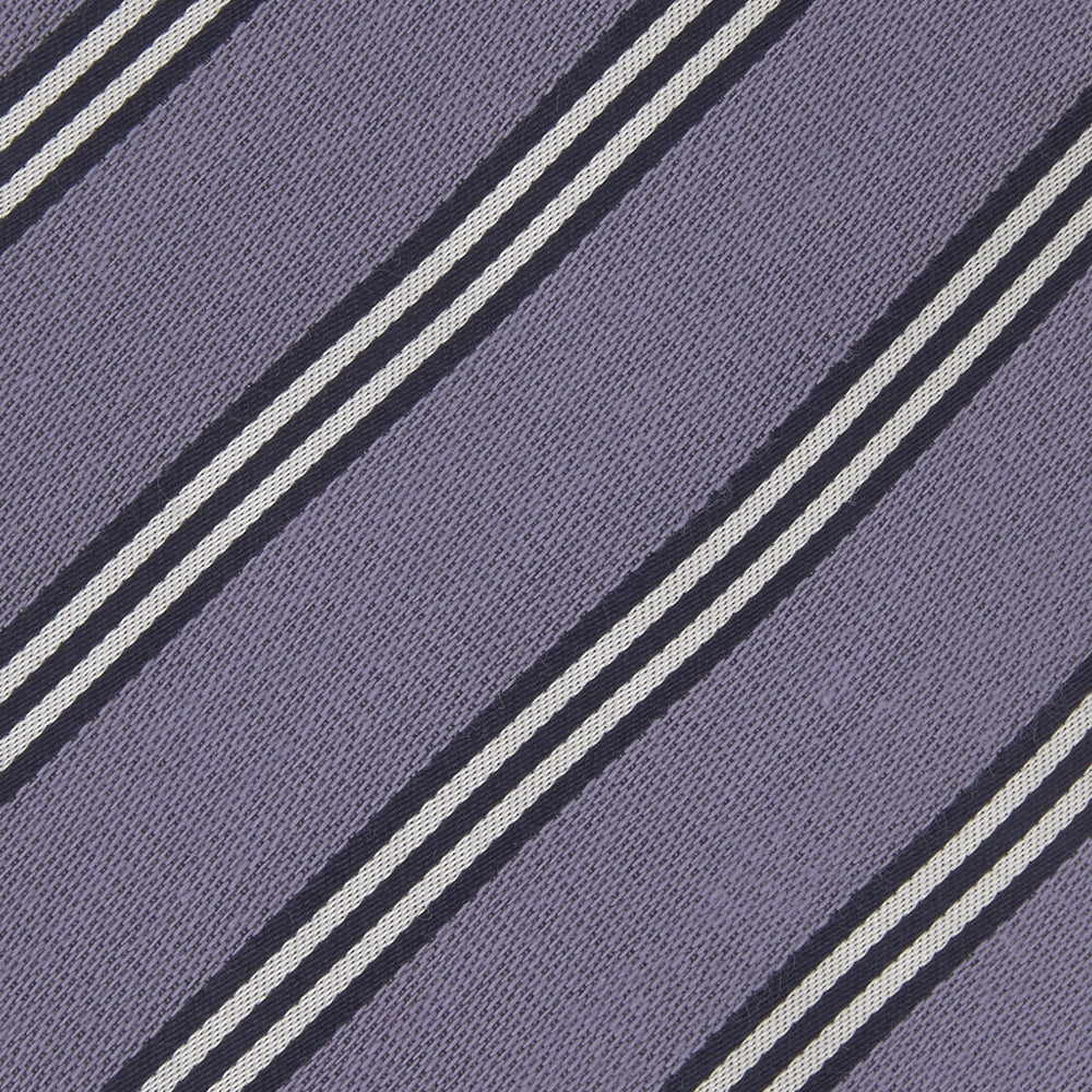 The Turnbull & Asser Lilac Diagonal Stripe Cotton and Silk Tie features classic black and white stripes, shown neatly rolled on a white background.