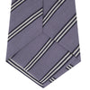 View 4 of product The Turnbull & Asser Lilac Diagonal Stripe Cotton and Silk Tie features classic black and white stripes, shown neatly rolled on a white background.