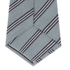 View 4 of product The Turnbull & Asser Powder Blue Diagonal Stripe Cotton and Silk Tie, featuring navy and white club stripes, is shown rolled up on a plain white background.