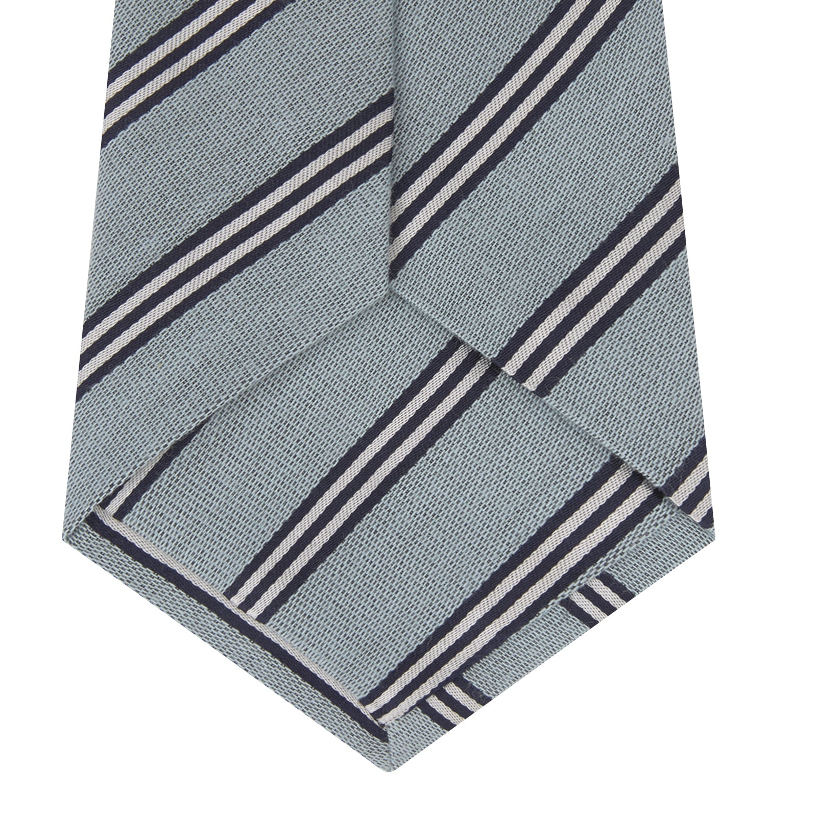 View 4 of product The Turnbull & Asser Powder Blue Diagonal Stripe Cotton and Silk Tie, featuring navy and white club stripes, is shown rolled up on a plain white background.