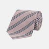 View 1 of product The Turnbull & Asser Pastel Pink Diagonal Stripe Cotton and Silk Tie, featuring navy blue and white stripes, is neatly rolled against a plain white background.