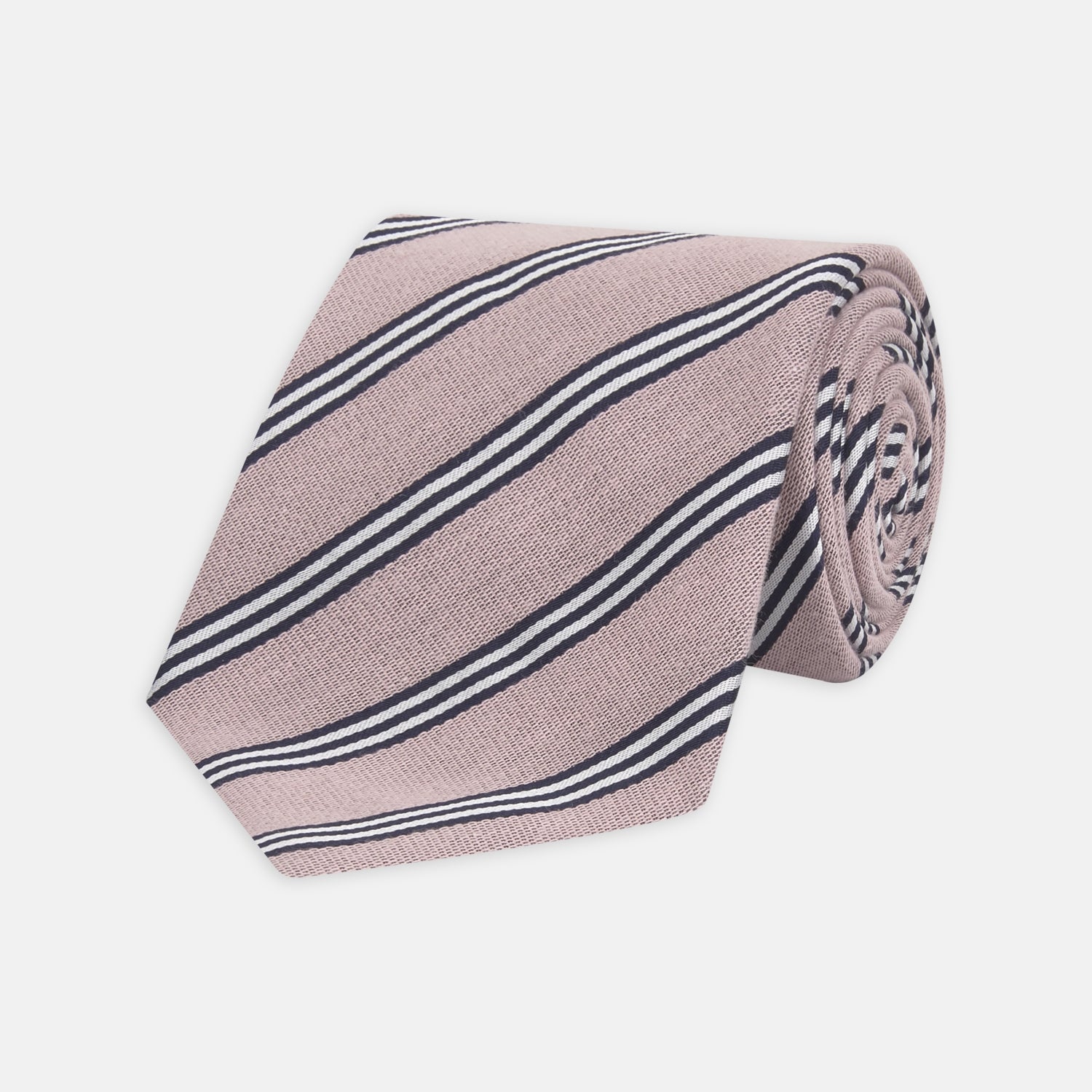 View 1 of product The Turnbull & Asser Pastel Pink Diagonal Stripe Cotton and Silk Tie, featuring navy blue and white stripes, is neatly rolled against a plain white background.
