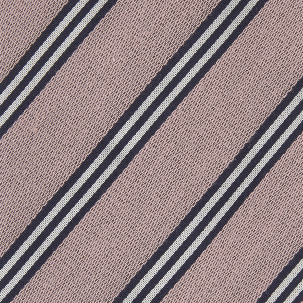 The Turnbull & Asser Pastel Pink Diagonal Stripe Cotton and Silk Tie, featuring navy blue and white stripes, is neatly rolled against a plain white background.