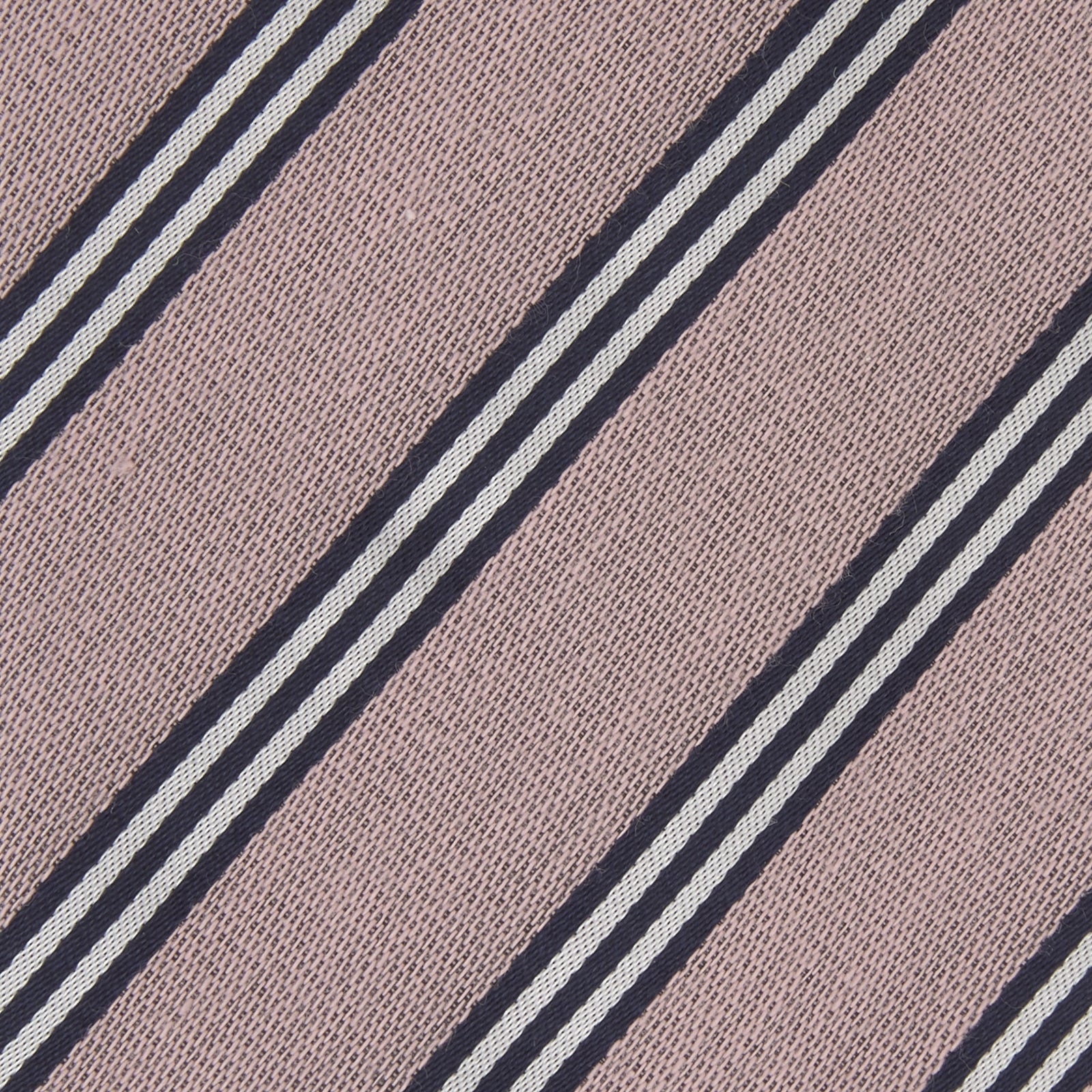 View 3 of product The Turnbull & Asser Pastel Pink Diagonal Stripe Cotton and Silk Tie, featuring navy blue and white stripes, is neatly rolled against a plain white background.