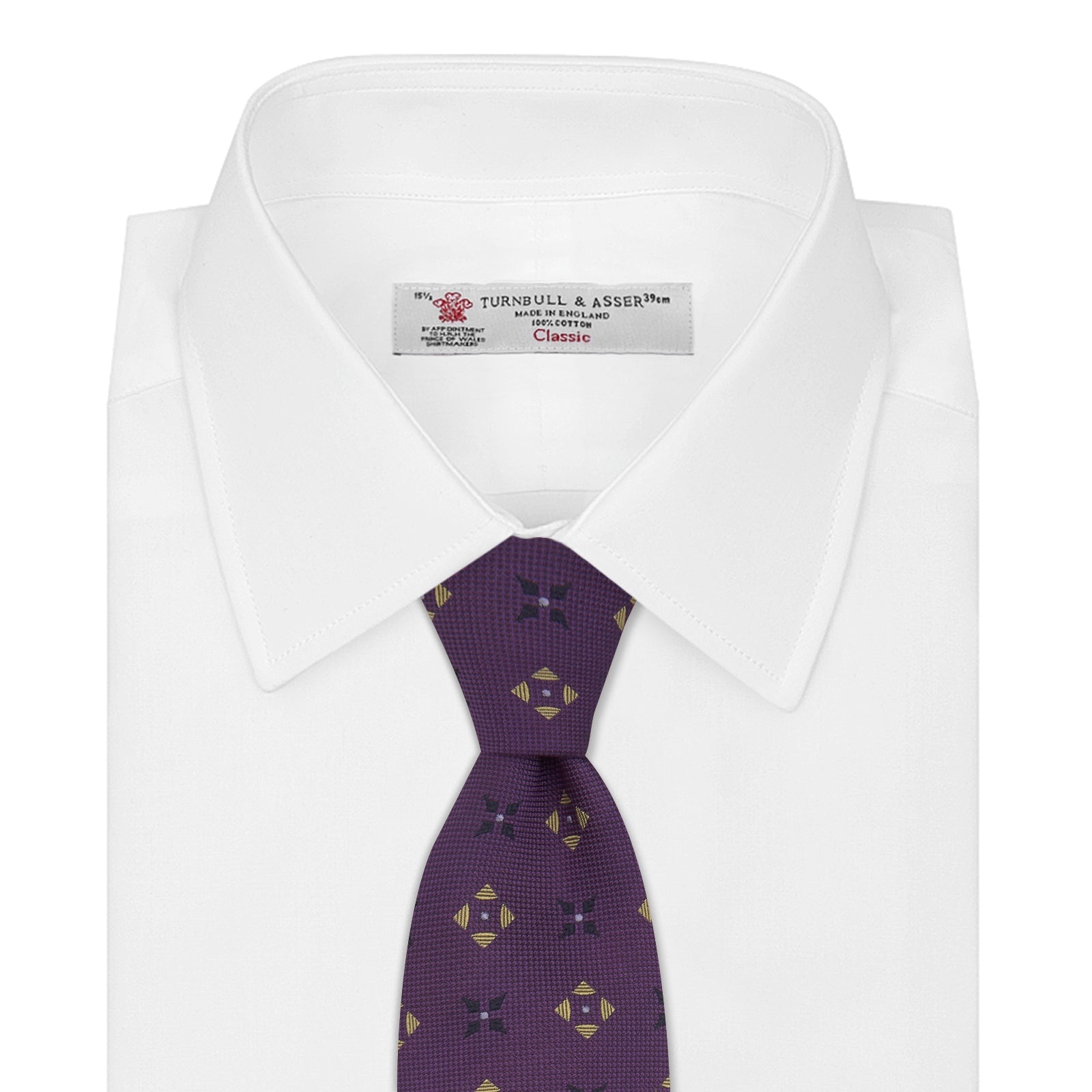 View 2 of product The Turnbull & Asser Purple Crosses Silk Tie features a rolled-up purple design with small yellow and black cross motifs on silk.