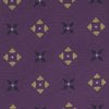 View 3 of product The Turnbull & Asser Purple Crosses Silk Tie features a rolled-up purple design with small yellow and black cross motifs on silk.