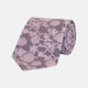 The Turnbull & Asser Pink Floral Occasion Silk Tie features a rolled-up purple jacquard design with a light pink floral pattern, perfect for weddings or floral events, shown on a plain white background.