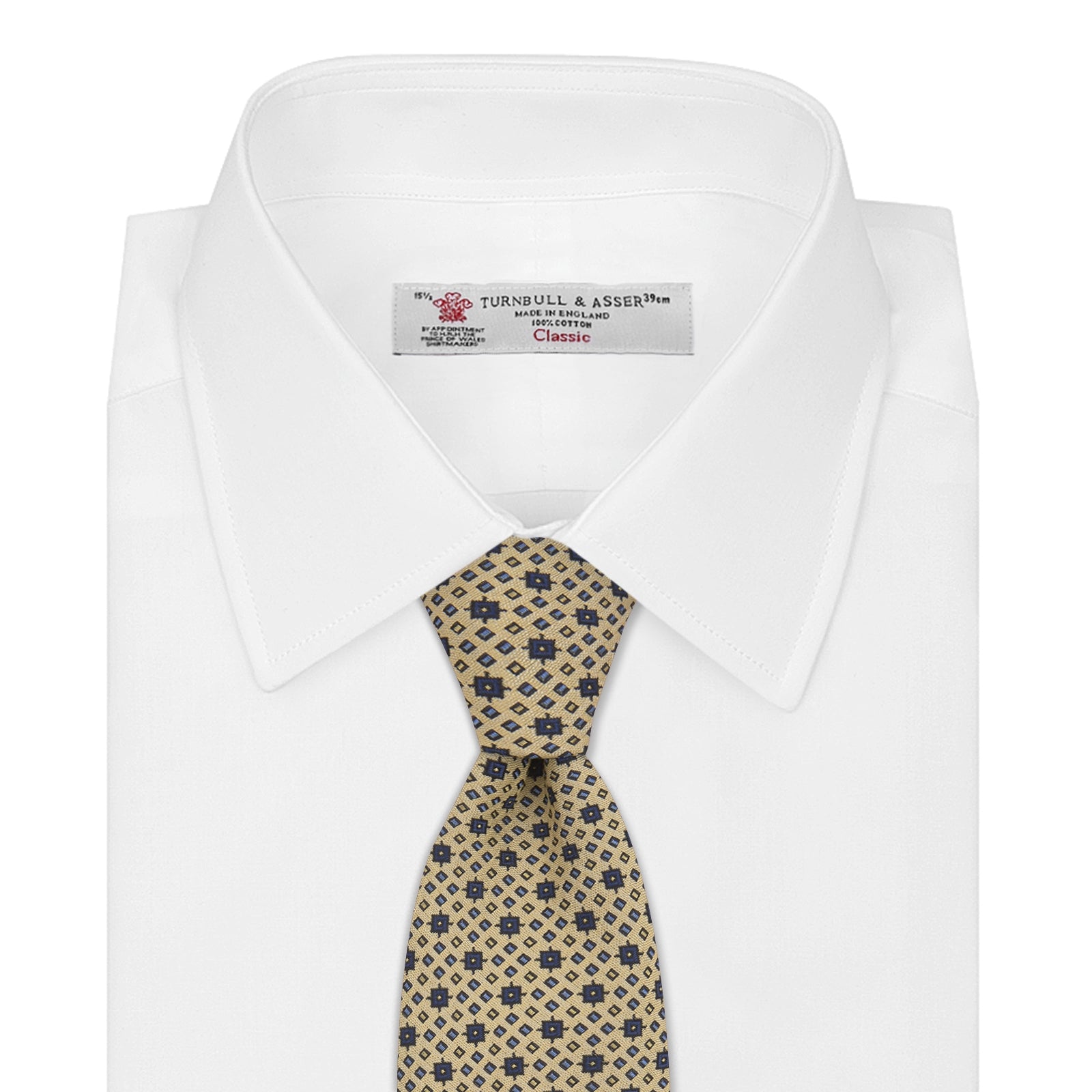 View 2 of product The Turnbull & Asser Pale Yellow Geometric Silk Tie features a subtle navy blue floral pattern and is displayed rolled on a white background.