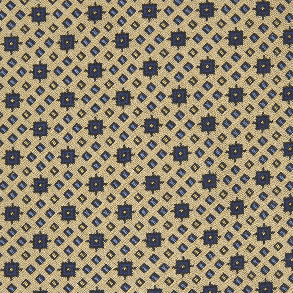 The Turnbull & Asser Pale Yellow Geometric Silk Tie features a subtle navy blue floral pattern and is displayed rolled on a white background.