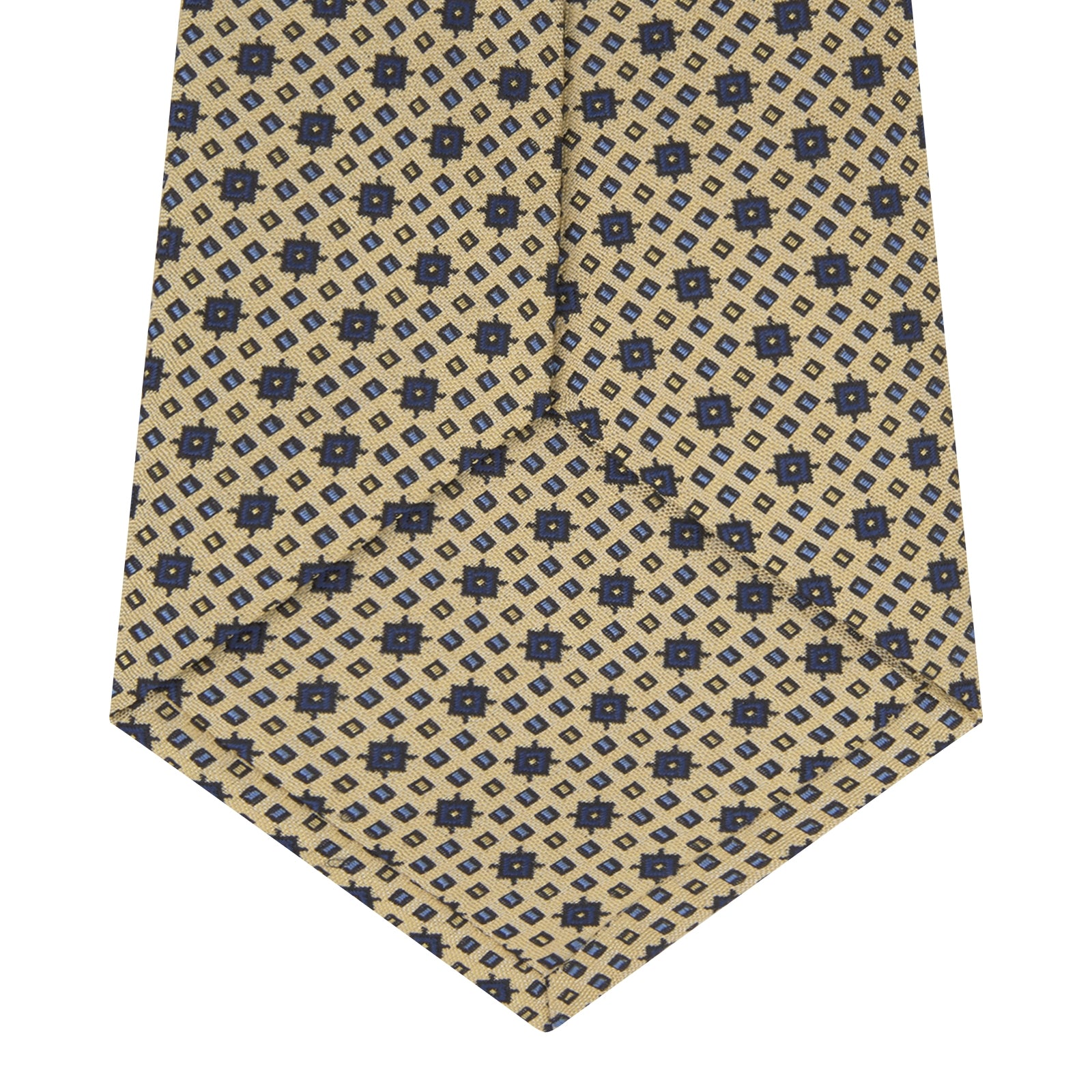 View 4 of product The Turnbull & Asser Pale Yellow Geometric Silk Tie features a subtle navy blue floral pattern and is displayed rolled on a white background.