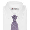 View 2 of product The Turnbull & Asser Lilac Geometric Silk Tie features a small, repeating mid-century motif in dark purple and black on white—an ideal accent for tailored jackets.