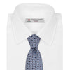 View 2 of product The Turnbull & Asser Sky Blue Geometric Silk Tie features a mid-century dark blue and maroon motif on light blue silk, shown against a white background—ideal for pairing with tailored jackets.