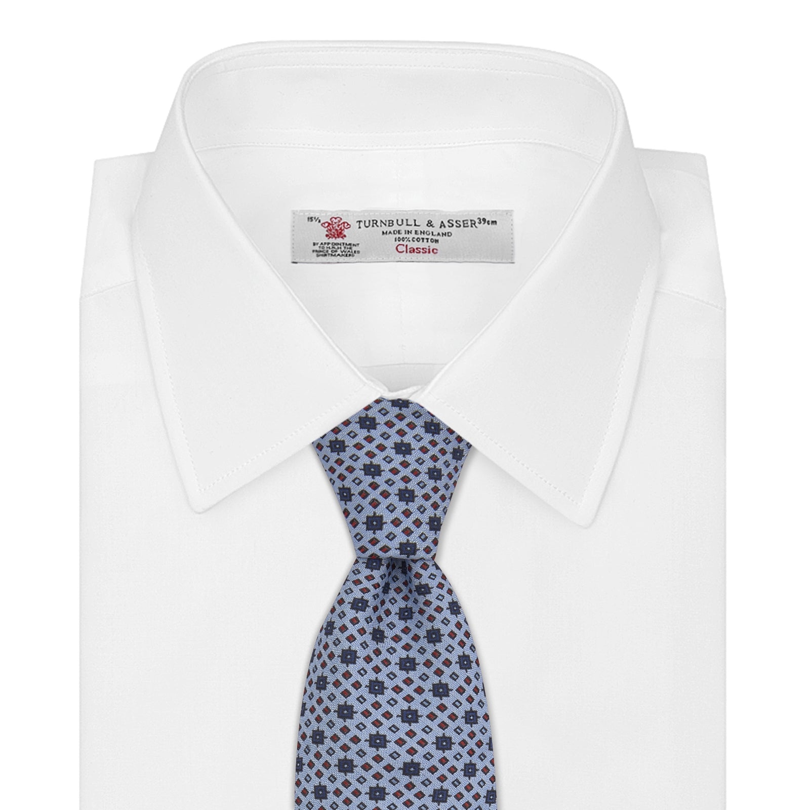 View 2 of product The Turnbull & Asser Sky Blue Geometric Silk Tie features a mid-century dark blue and maroon motif on light blue silk, shown against a white background—ideal for pairing with tailored jackets.
