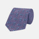 The Turnbull & Asser Purple Carp Silk Tie, woven in England, features blue koi fish and swirling patterns on purple silk and is shown against a plain white background.