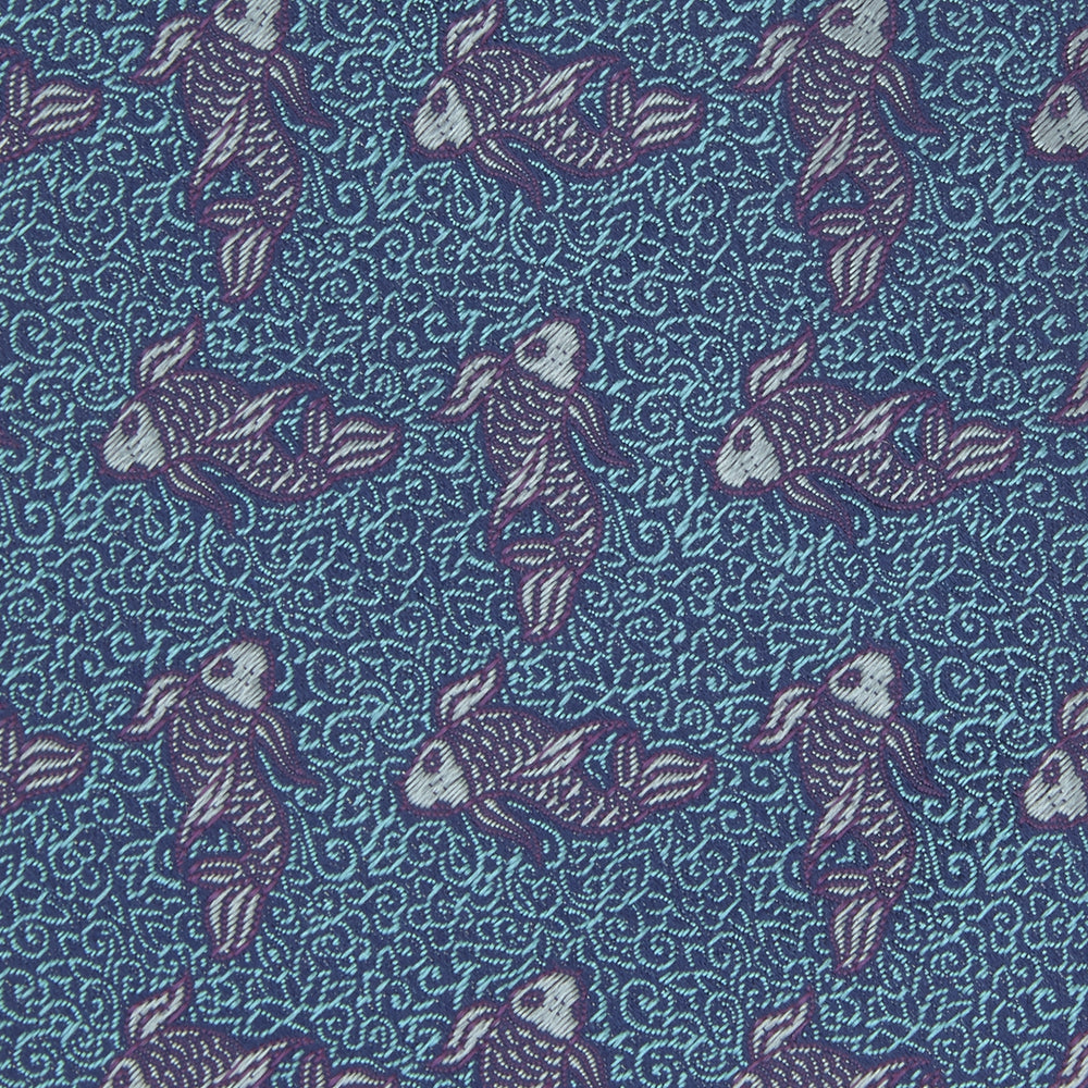 The Turnbull & Asser Turquoise Carp Silk Tie is woven in England, featuring a repeating white and brown carp design on a light blue background with intricate swirling patterns.