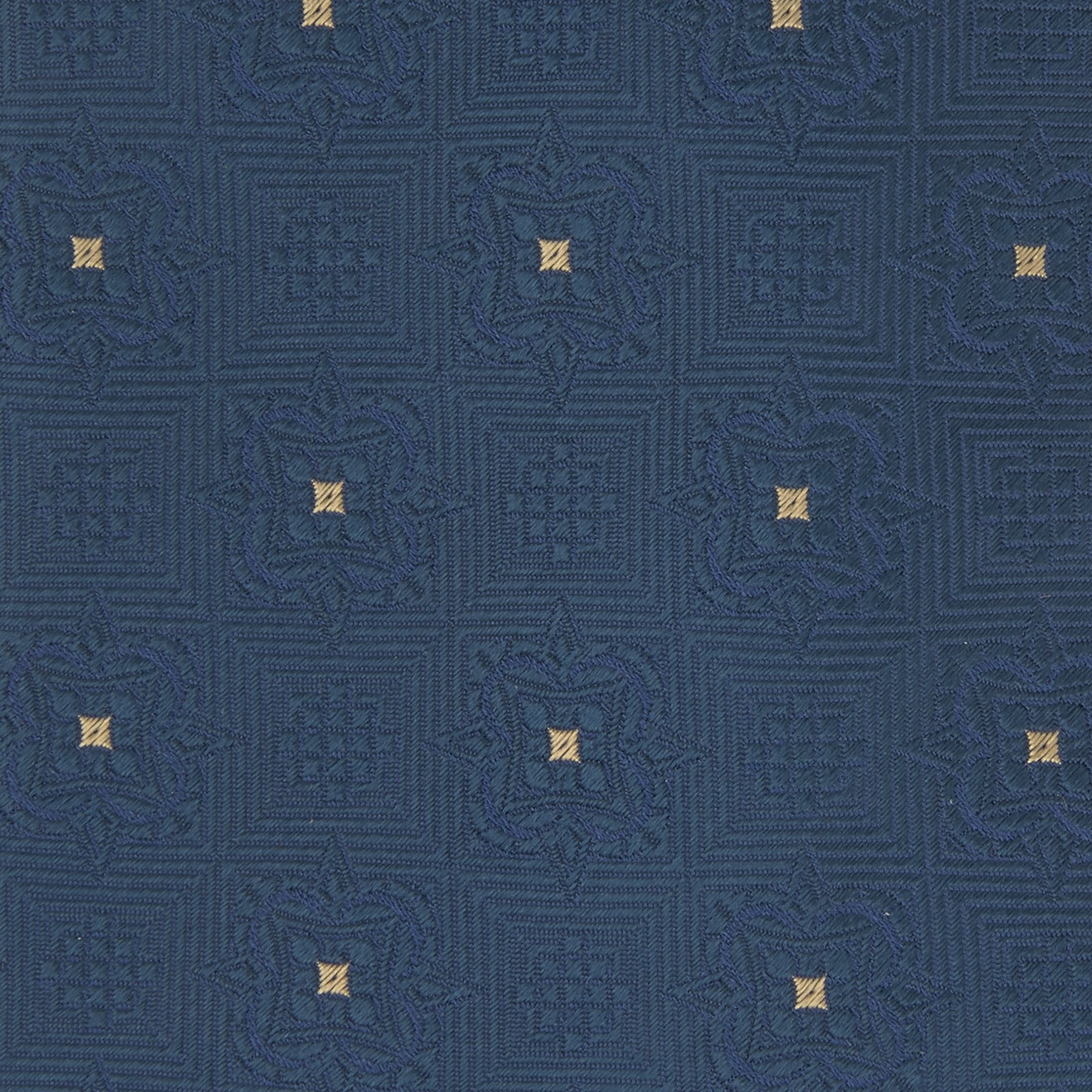 View 3 of product The Deep Turquoise Flower Mosaic Silk Tie by Turnbull & Asser features a jacquard design in blue with a subtle geometric pattern and small gold square accents evenly spaced across the fabric.