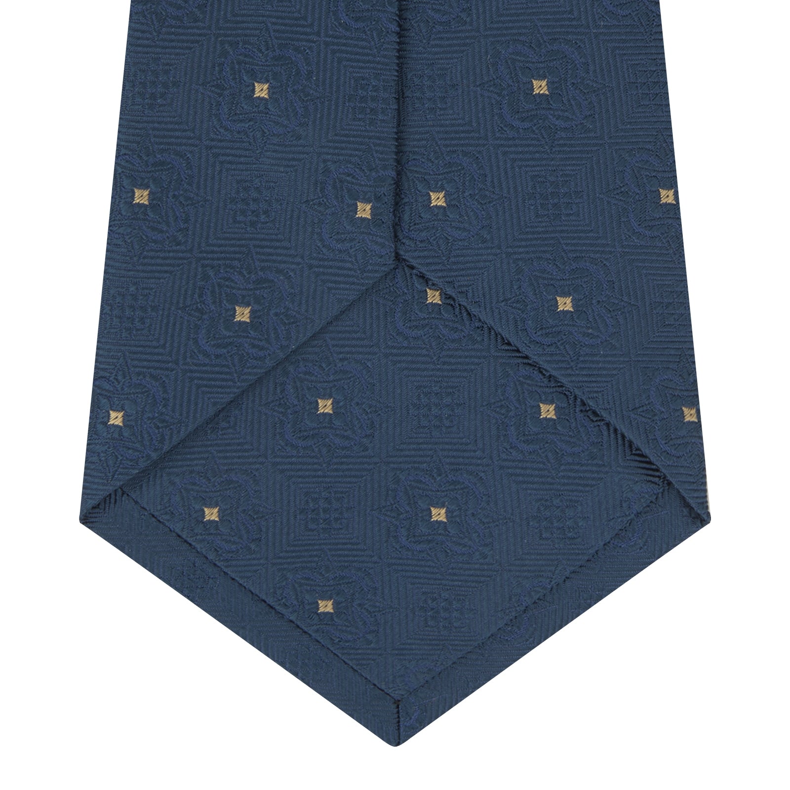 View 4 of product The Deep Turquoise Flower Mosaic Silk Tie by Turnbull & Asser features a jacquard design in blue with a subtle geometric pattern and small gold square accents evenly spaced across the fabric.