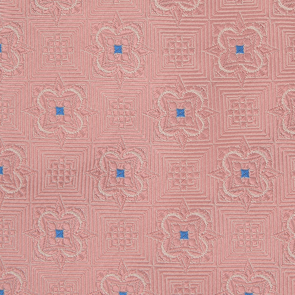 The Pink Flower Mosaic Silk Tie by Turnbull & Asser features a subtle jacquard texture with small blue floral accents, shown on a white background.