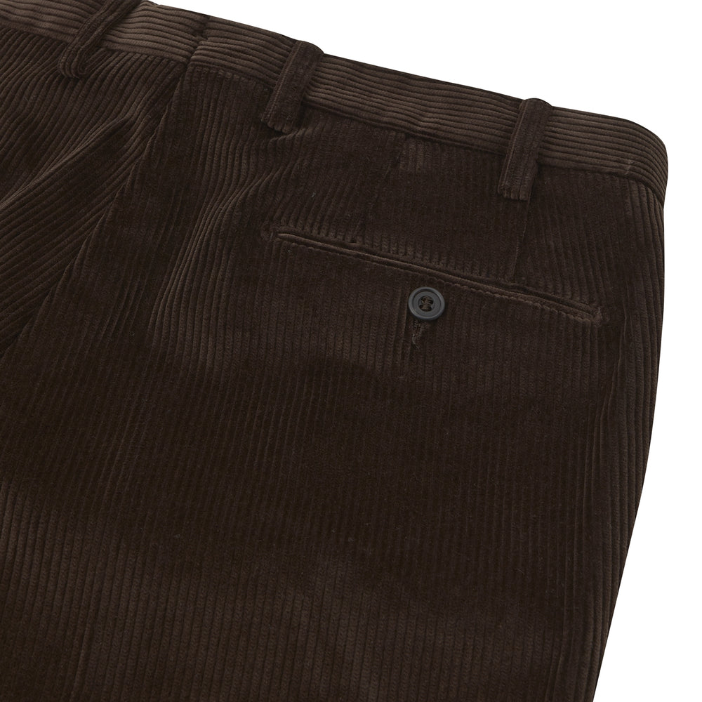 Turnbull & Asser’s Chocolate Brown Corduroy Trousers feature a straight-leg cut, side pockets, and belt loops—ideal for upgrading your winter wardrobe—shown against a plain white background.